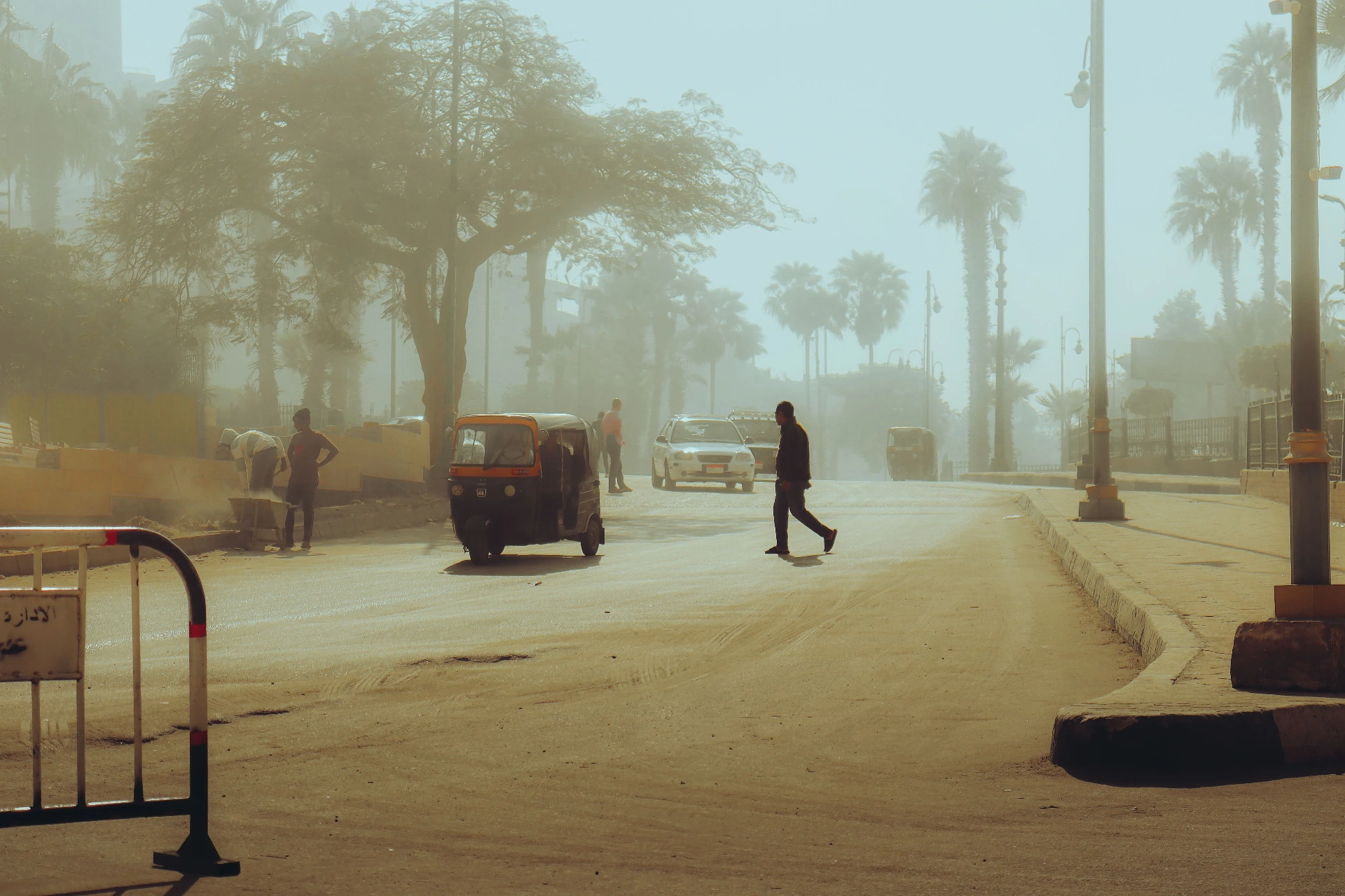 Street traffic and dust in an Indian city