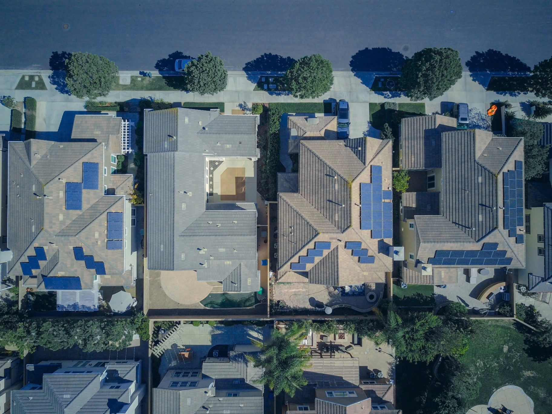 Aerial view of a residential neighborhood with rooftop solar panels