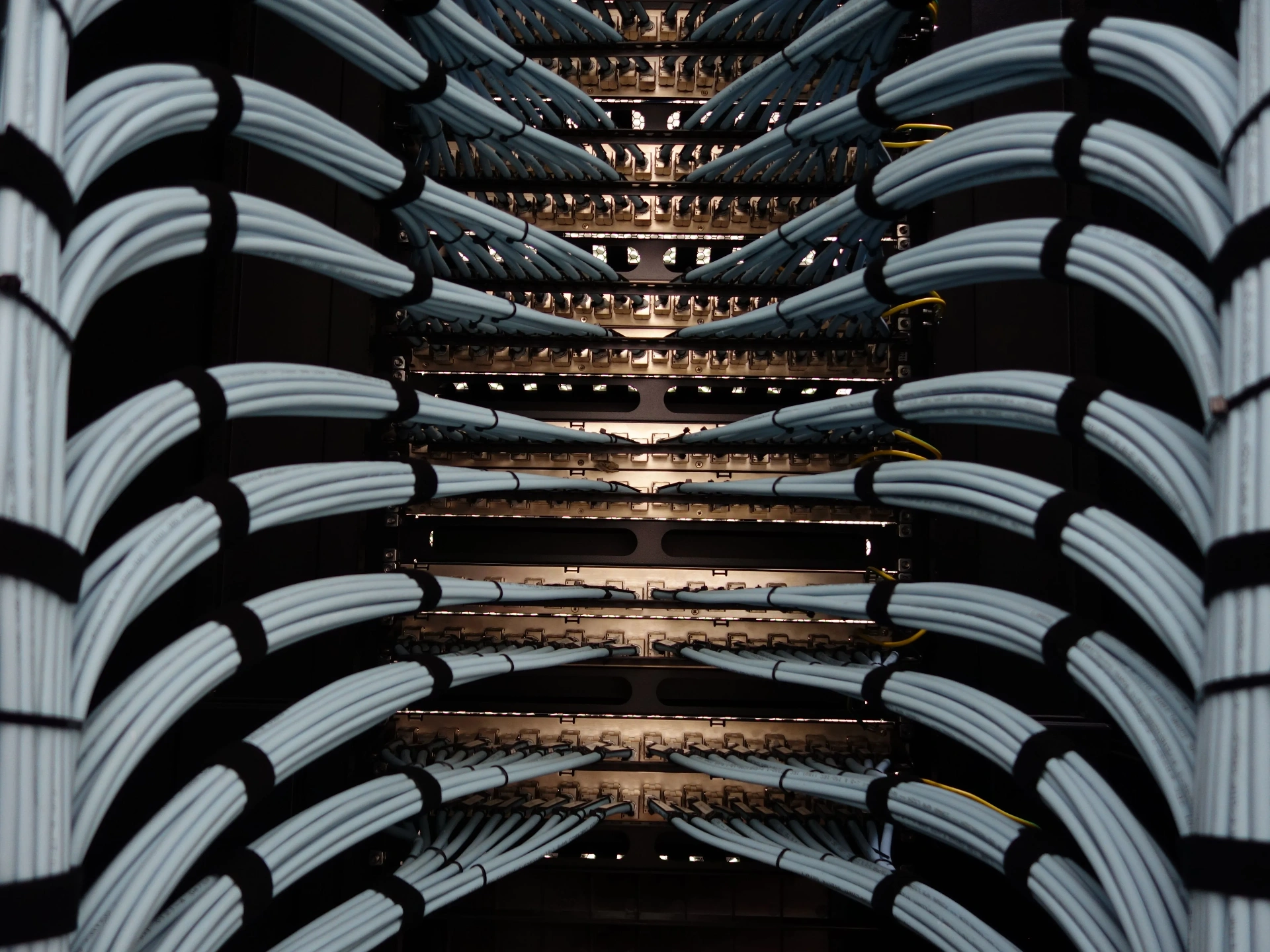 Rows of data center server cabling and cooling infrastructure