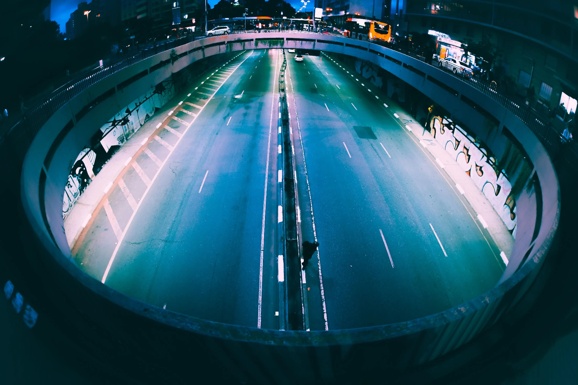 Wide-angle night view of an urban roadway