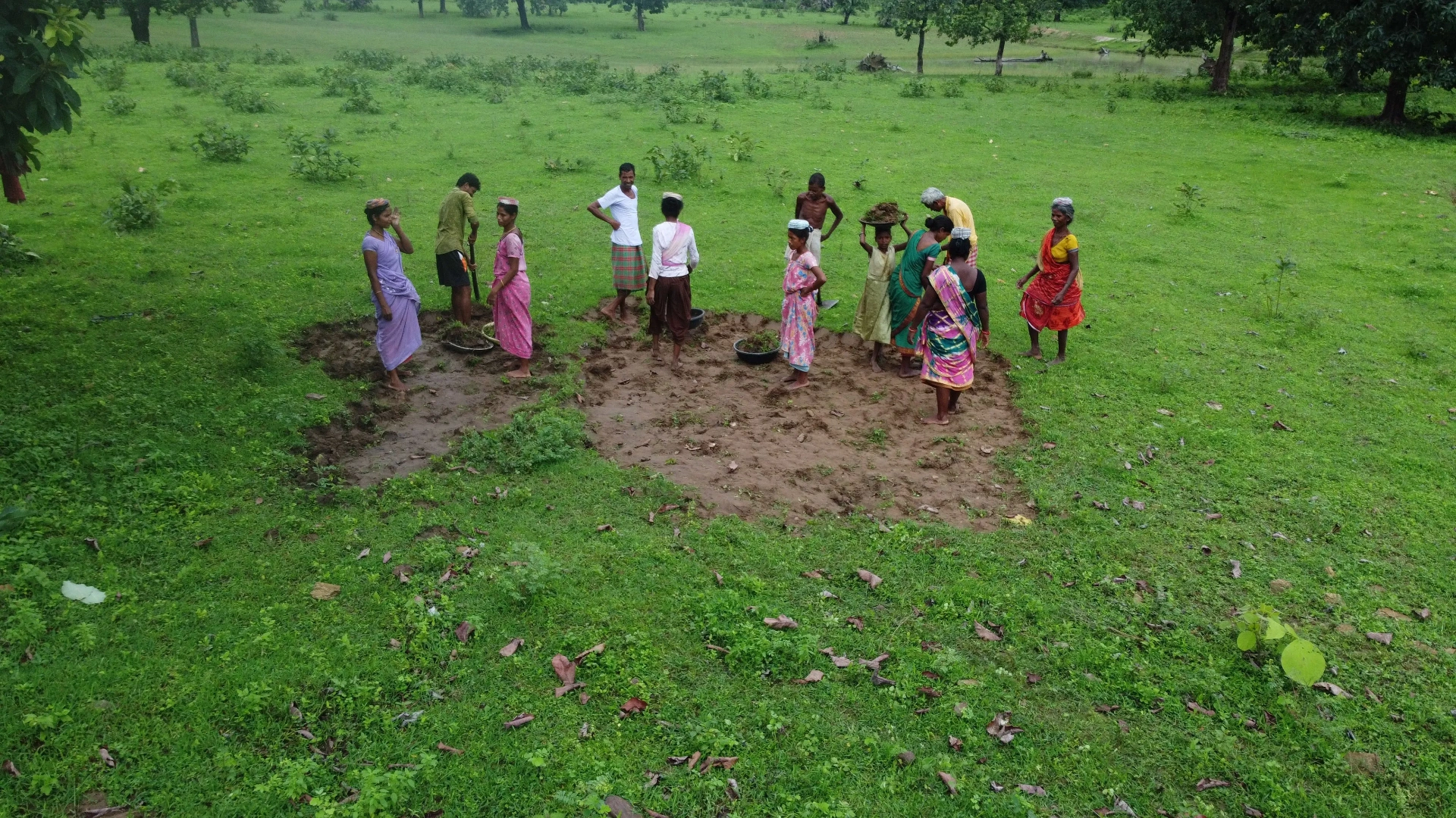 A community working together on the land in a rural setting